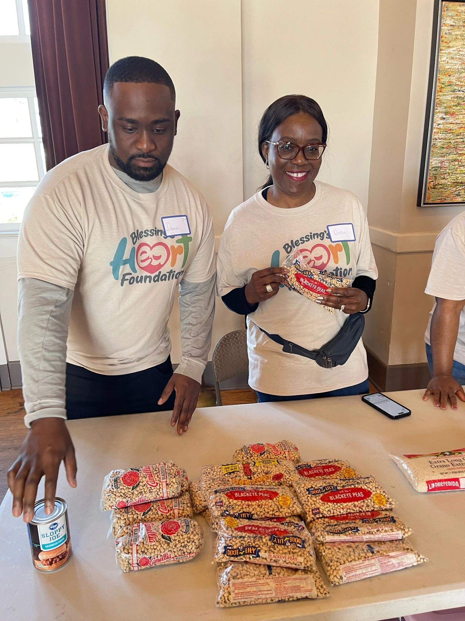 Volunteers with food pantry supplies